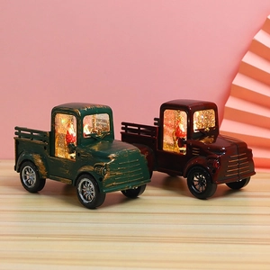 Macro detail of retro metal Christmas tractor decor with light-up Santa and weathered finish