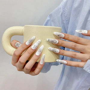 Handcrafted silver rabbit and diamond long coffin nails on a white base for women