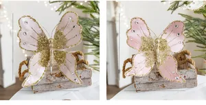 Close-up of pink fabric butterfly Christmas ornament with gold glitter and rhinestones