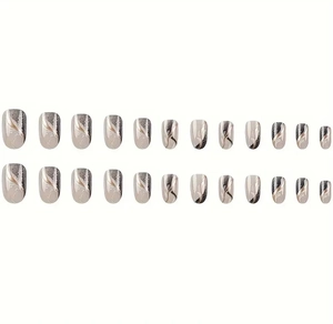 Detail of 26pcs grey and gold gradient false nails with feather texture and glossy finish