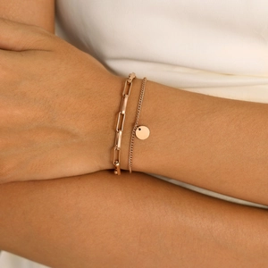 Elegant rose gold double-layer bracelet with paperclip chain and polished round pendant
