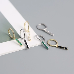 Detailed macro view of S925 silver hoop earrings with rectangular zircon stones in five colors