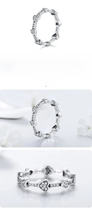 Macro shot of S925 sterling silver ring featuring linked heart-shaped zircon stones