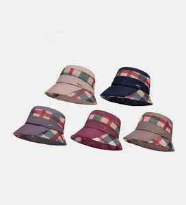 Detail of plaid brim sun hats in five colors with metallic LOVE ornament detail
