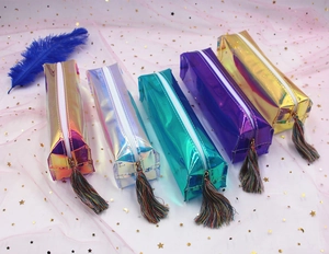 Detailed macro view of laser iridescent TPU pencil cases with fringe zipper pulls