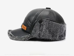 Detail of men's winter leather hat featuring thick grey faux fur lining and ear flaps