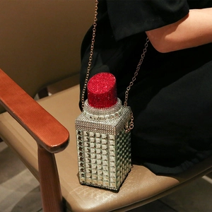 Sparkling lipstick shaped crossbody bag with silver rhinestones and gold chain strap