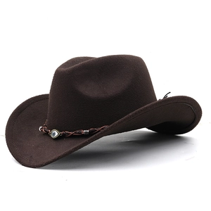 Detail of brown western cowboy hat featuring a braided band and evil eye bead charm