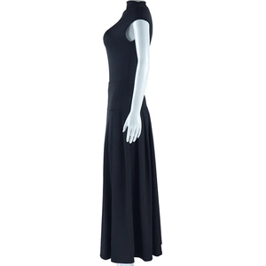Detail of a black sleeveless maxi skirt set showing the knit fabric and waistline tailoring