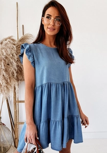 Detail of blue ruffled sleeve denim dress with a tiered skirt and washed fabric texture