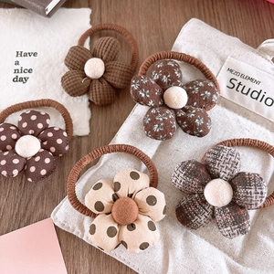 Set of 5 floral hair ties for girls in brown corduroy and vintage patterns on wooden table