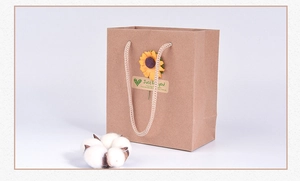 Close-up of vintage brown kraft paper gift bag with sunflower and Just for you label