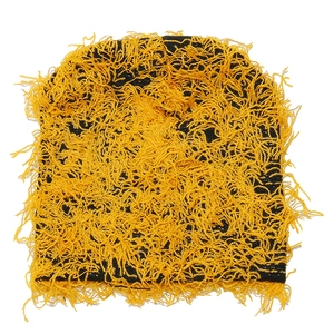 Detail view of yellow and black shaggy distressed tassel beanie with textured knit pattern