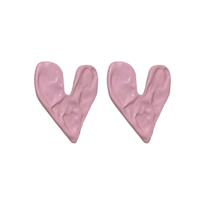 Minimalist pink heart stud earrings with irregular lava texture and french chic aesthetic