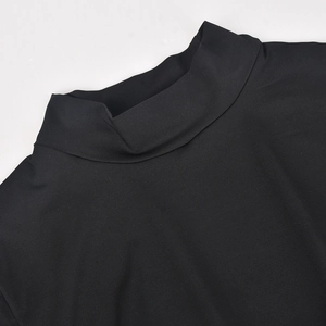 Close-up of black turtleneck knit collar and shoulder stitching on long sleeve top
