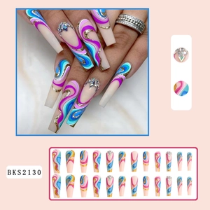 Long coffin press-on nails with blue purple wave patterns, gold glitter and rhinestones