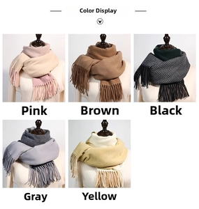 Detailed color display of gradient cashmere-like scarves with classic tassel accents