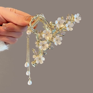 Elegant gold metal flower hair claw clip with white tassels and pearl pendants