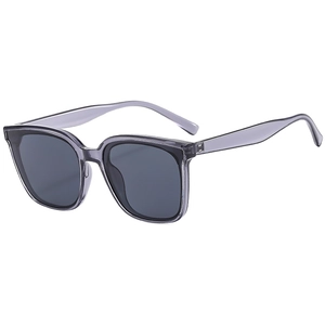 Fashionable oversized sunglasses with translucent purple frames and dark grey lenses