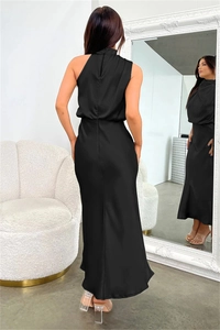 Detail view of black satin halter dress with elegant open back and draped silk-like finish
