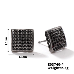 Detailed view of 1.1cm geometric copper earrings with black pave-set zircon stones