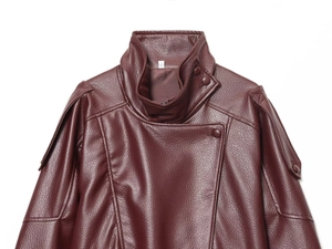 Detail of burgundy faux leather jacket showing stand collar and textured grain finish