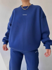 Women's dark blue two-piece set featuring an oversized sweatshirt and jogger pants