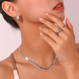 Silver stainless steel jewelry set with layered snake chain and textured wave ring