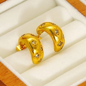 Elegant gold plated C-shaped hoop earrings with sparkling cubic zirconia in a jewelry box