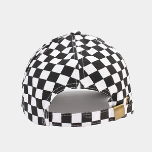 Detail of checkered baseball cap with adjustable metal buckle on back view