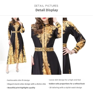 Detail of baroque black and gold printed dress featuring stand collar and waist belt