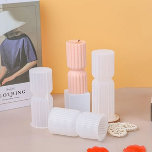 Detailed view of ribbed cylindrical silicone candle mold with finished pillar candle