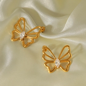 Detailed close-up of golden butterfly earrings with marquise-cut cubic zirconia inlays