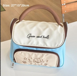 Detail view of large capacity blue and cream toiletry bag with 27x15x20cm dimensions