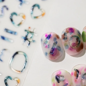 Matte translucent nail stickers featuring colorful ink abstract patterns and heart shapes
