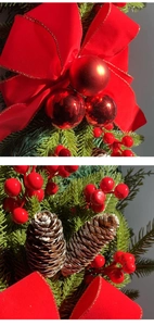 Detailed macro shot of red velvet bows, pine cones, and frosted berries on a Christmas wreath