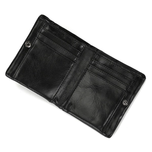 Interior detail of a black genuine leather bifold wallet with multiple card slots