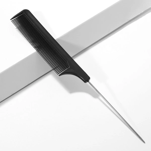 Detail of professional black parting comb with fine metal tail and plastic teeth