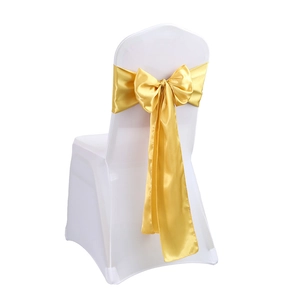 White stretch banquet chair cover with a decorative gold satin bow on the backrest