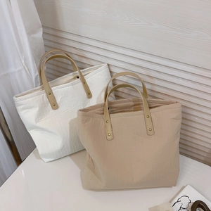 Minimalist beige and khaki striped cotton tote bags with brown leather handles