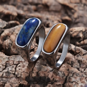 Macro view of vintage silver ring featuring natural blue lapis and golden tiger eye stones