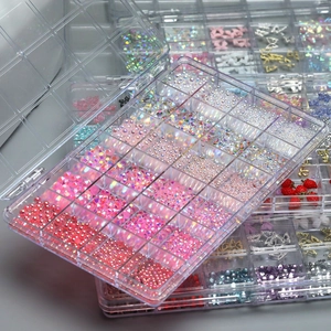 24-grid nail art kit with pink bows, pearls, and assorted flatback crystals in a box