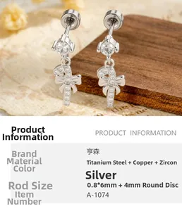 Detail view of silver candy cane stud with bow detail and shimmering zircon stones