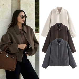 Detailed view showing polo collar, metal zipper, and drop shoulder wool coat for women
