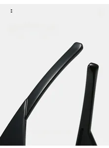 Detail view of glossy black curved temple arms on oversized cat eye sunglasses