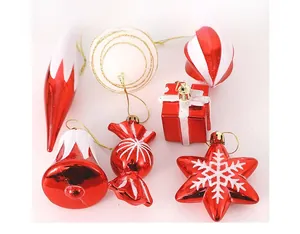 Detailed view of red and white glitter Christmas ornaments including bells and candies