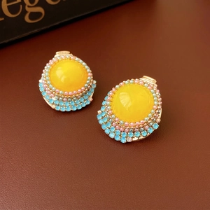 Vintage gold-toned round stud earrings with yellow stone and colorful crystal halo