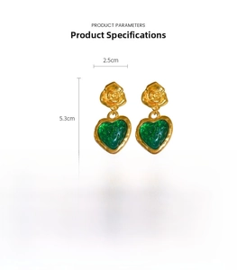 Detail view of vintage gold rose earrings with green resin hearts showing 5.3cm length