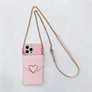Pink phone case bag with gold heart clasp and crossbody metal chain strap
