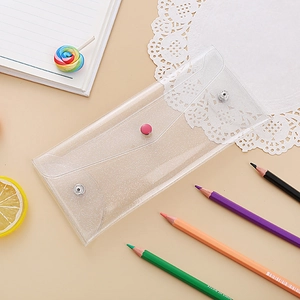 Detail of laser transparent PVC pencil case with glitter effect and snap closures
